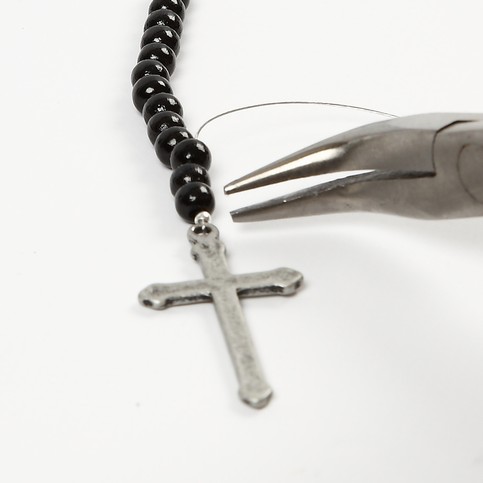 A Pendant of Christ with Wooden Beads