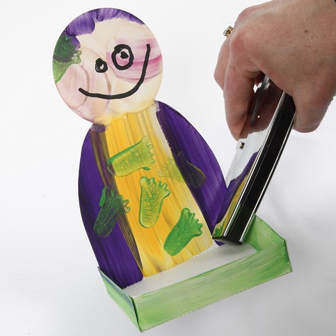 A Cardboard Figure with a Cress Tray
