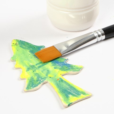 A Wooden Hanging Decoration painted with Oil Pastels