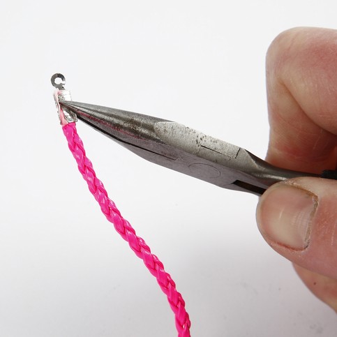 A Neon-Coloured Plaited Bracelet with a Pendant