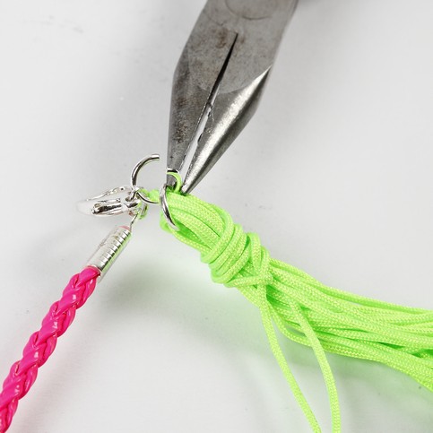 A Neon-Coloured Plaited Bracelet with a Pendant