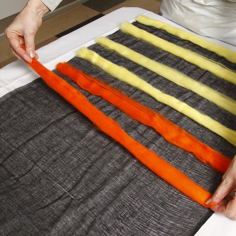 A Black Scarf with colourful Felt Stripes