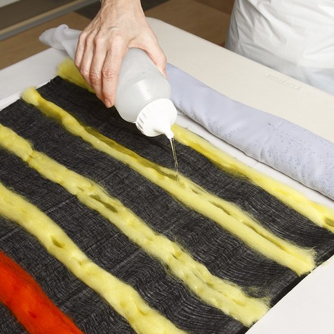 A Black Scarf with colourful Felt Stripes