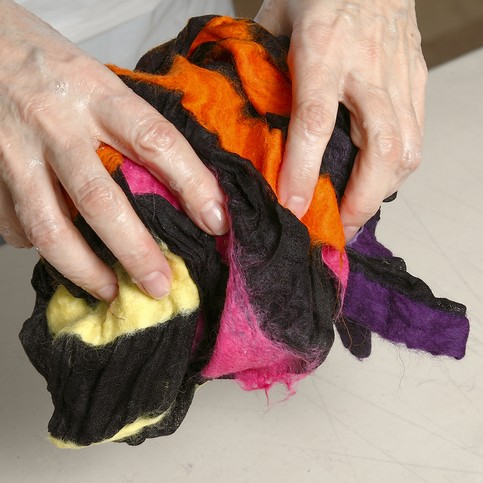 A Black Scarf with colourful Felt Stripes