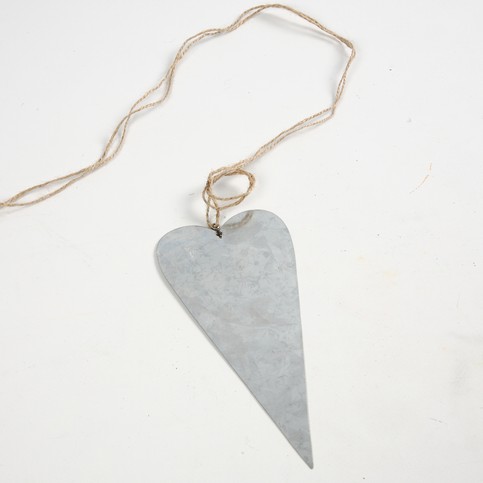 A Mobile made from Half Tree Trunks and a Galvanized Metal Heart