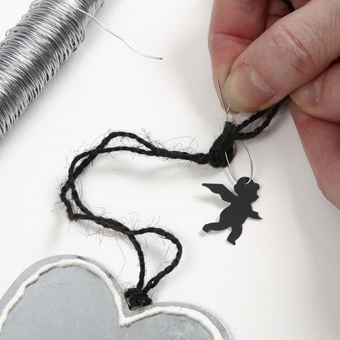 A Metal Heart decorated with Music Notes Kraft Paper and an Angel