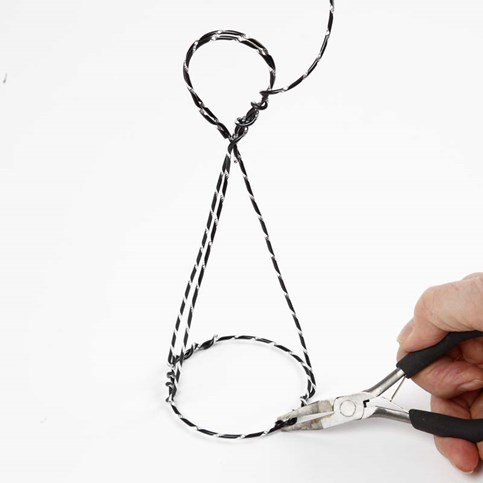 An Angel on a Stand made from black Aluminium Wire with Diamond Cut