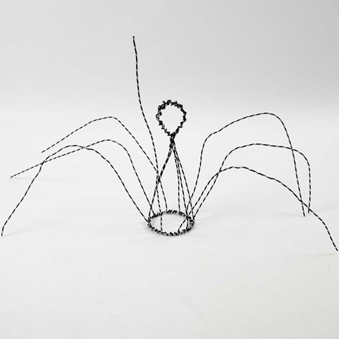 An Angel on a Stand made from black Aluminium Wire with Diamond Cut