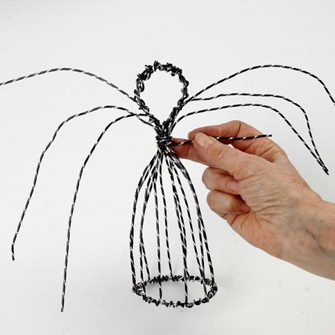 An Angel on a Stand made from black Aluminium Wire with Diamond Cut