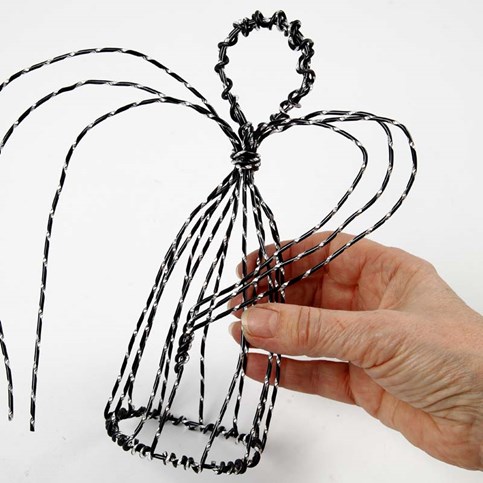 An Angel on a Stand made from black Aluminium Wire with Diamond Cut