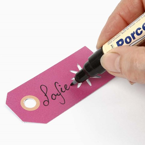 A Manilla Tag with a Punched-Out Design as a Place Card