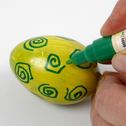 A painted Terracotta Egg with a Pattern drawn using a marker