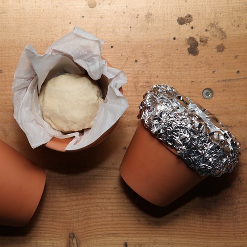 Bread made on a Bonfire in a Lined Red Terracotta Flower Pot