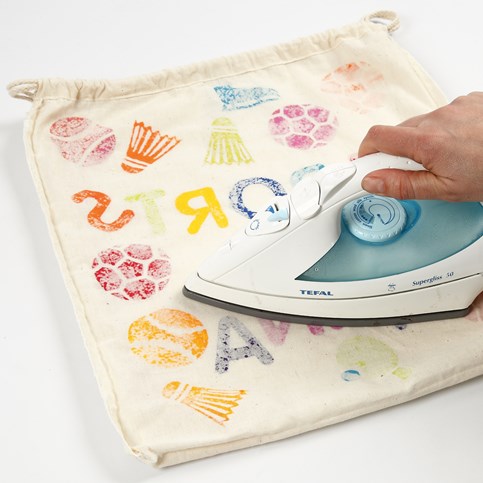 A Shoe Bag with stamped Designs and Text