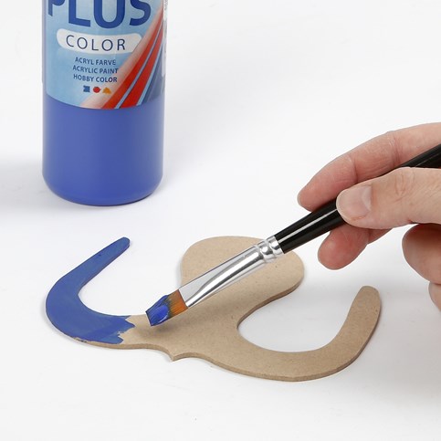 A flat wooden decorative Shape – painted and decorated with Mosaics