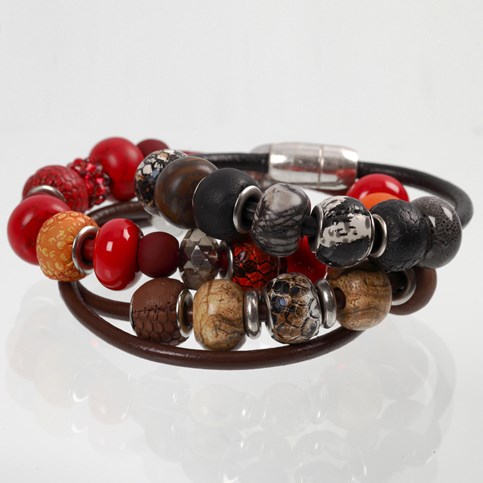 A Bracelet made from a thick Piece of Leather Cord with Links and Spacer Beads