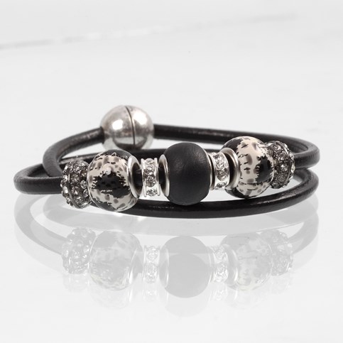 A Bracelet made from a thick Piece of Leather Cord with Links and Spacer Beads