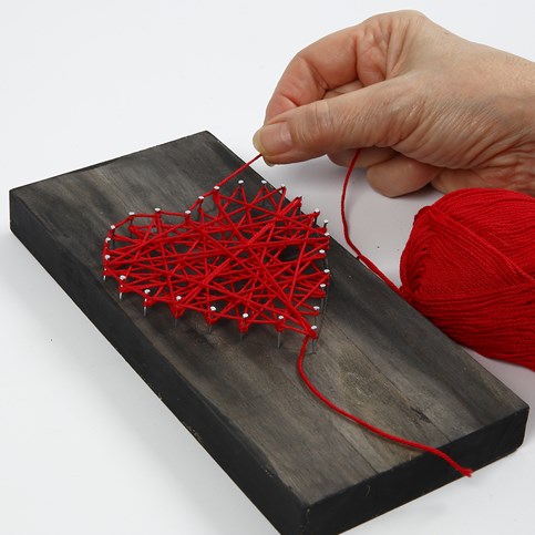 A woven Heart on a painted wooden Icon Plate
