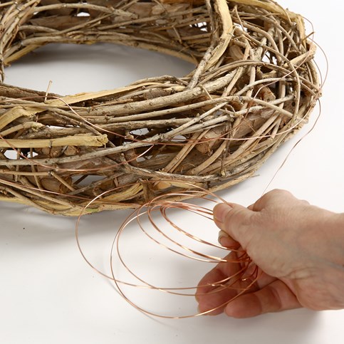 A natural Wreath decorated with Birds, Feathers and Eggs