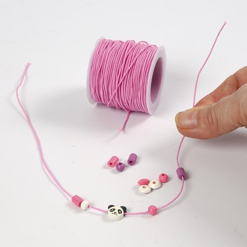 A Bracelet made from coloured Elastic Cord with a Shaped Wooden Bead and Wooden Beads