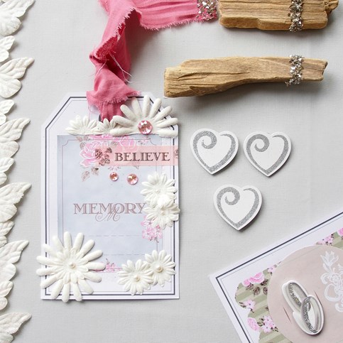A large Gift Tag with Vivi Gade Design Paper and Decorations