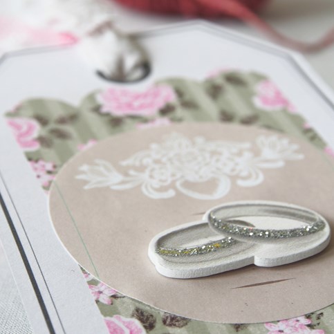A large Gift Tag with Vivi Gade Design Paper and Decorations