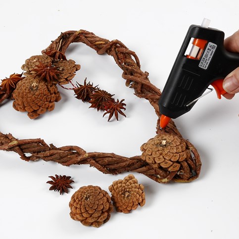 A woven heart-shaped Garland made from natural Branches with Cones and Star Anise