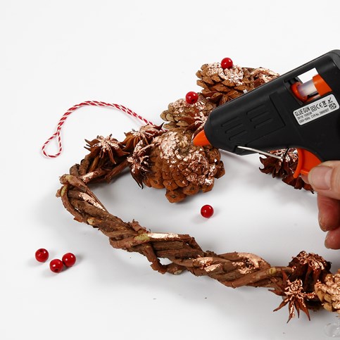 A woven heart-shaped Garland made from natural Branches with Cones and Star Anise