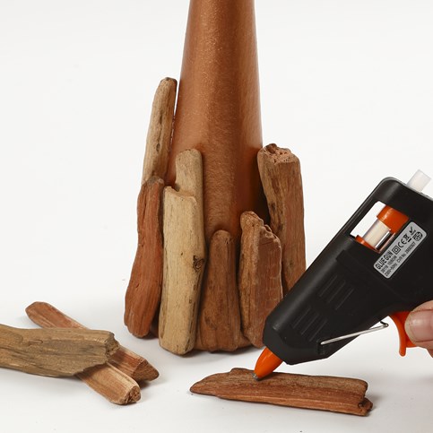A Papier-M ch Cone Christmas Tree and a Tea Light Holder decorated with small Pieces of Wood