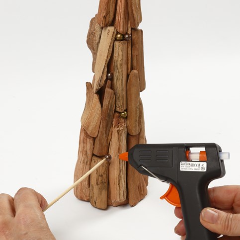A Papier-M ch Cone Christmas Tree and a Tea Light Holder decorated with small Pieces of Wood