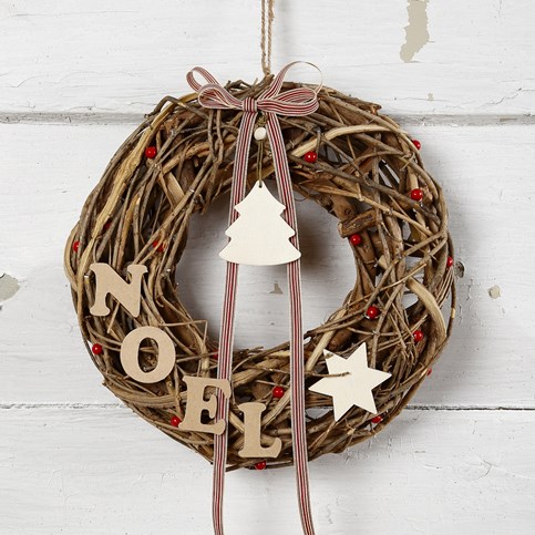 A Garland made from natural Twigs with wooden Decorations and a Bow