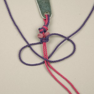 A Bottle opener with a pendant