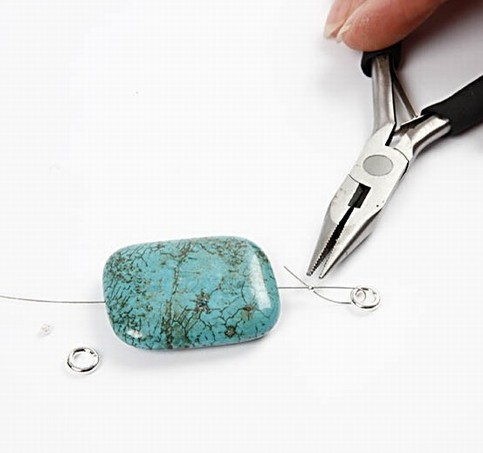 A bracelet with a large turquoise stone bead