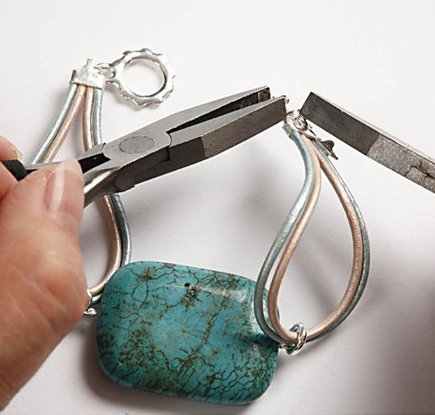 A bracelet with a large turquoise stone bead